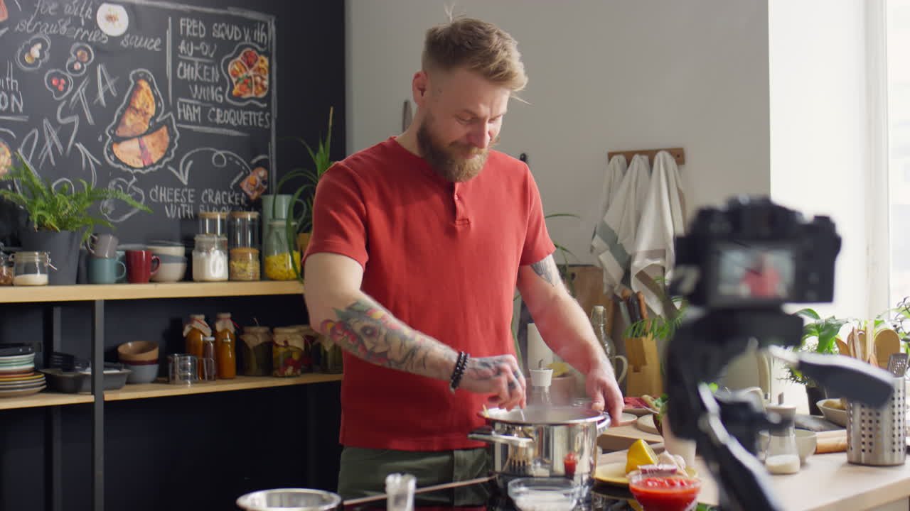 Food Blogger Cooking Food and Talking on Camera in Kitchen