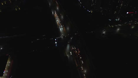 aerial night view of city traffic intersection
