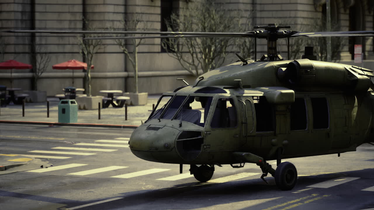 Military helicopter lands on urban street during midday operations