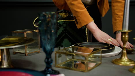 asian woman putting ornaments on a table