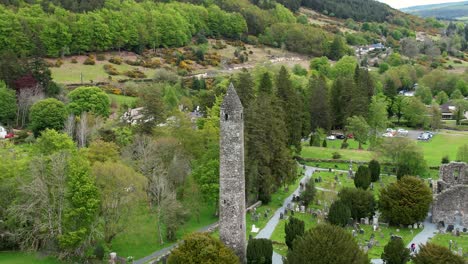 aerial view of glendalough monastic settlement ruins with focus on the round tower