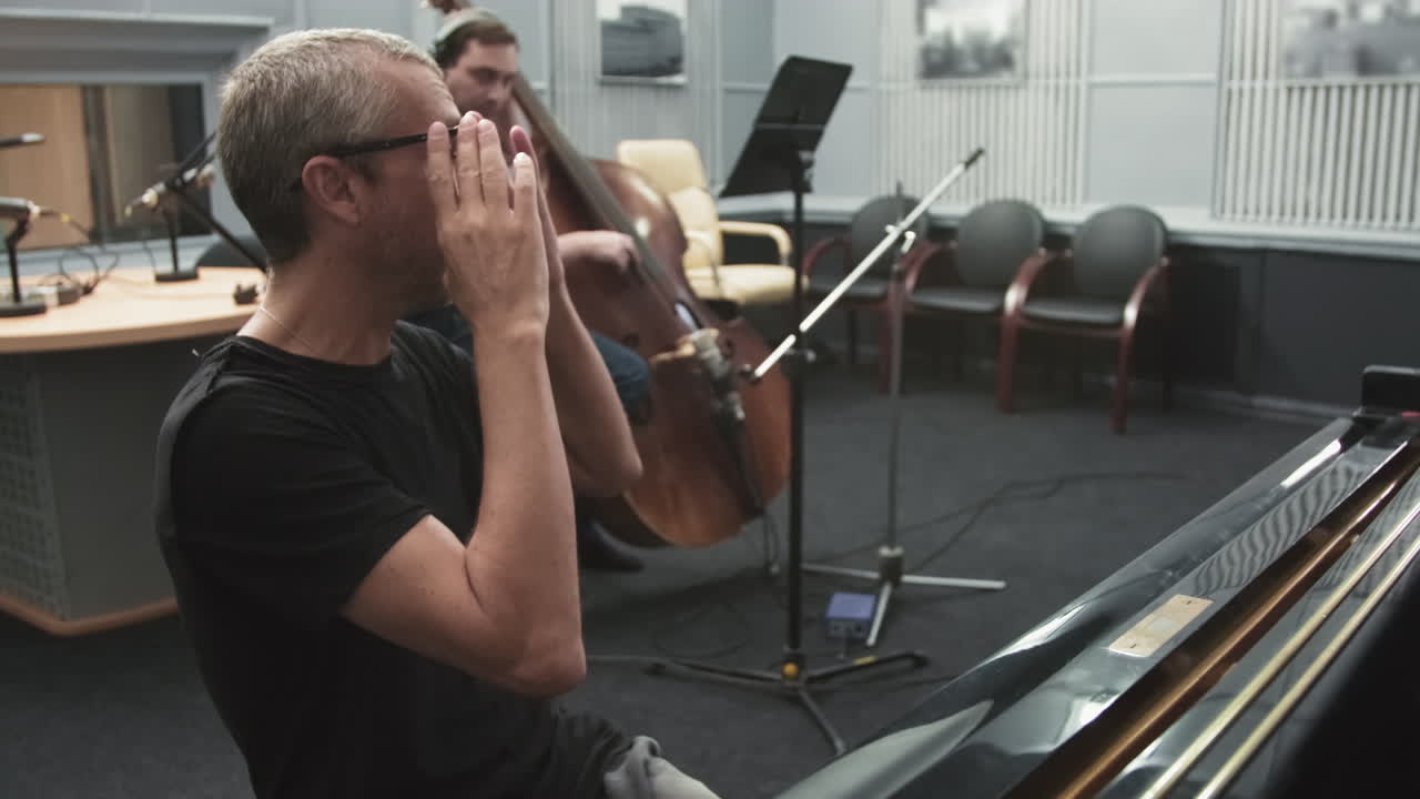 Jazz Musicians Playing In Live Room At Recording Studio
