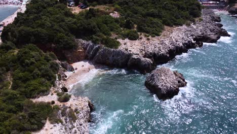 secluded nudist beach on shore of adriatic sea, aerial