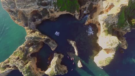 the famous cliffs and caves of farol da ponta da piedade in lagos, portugal