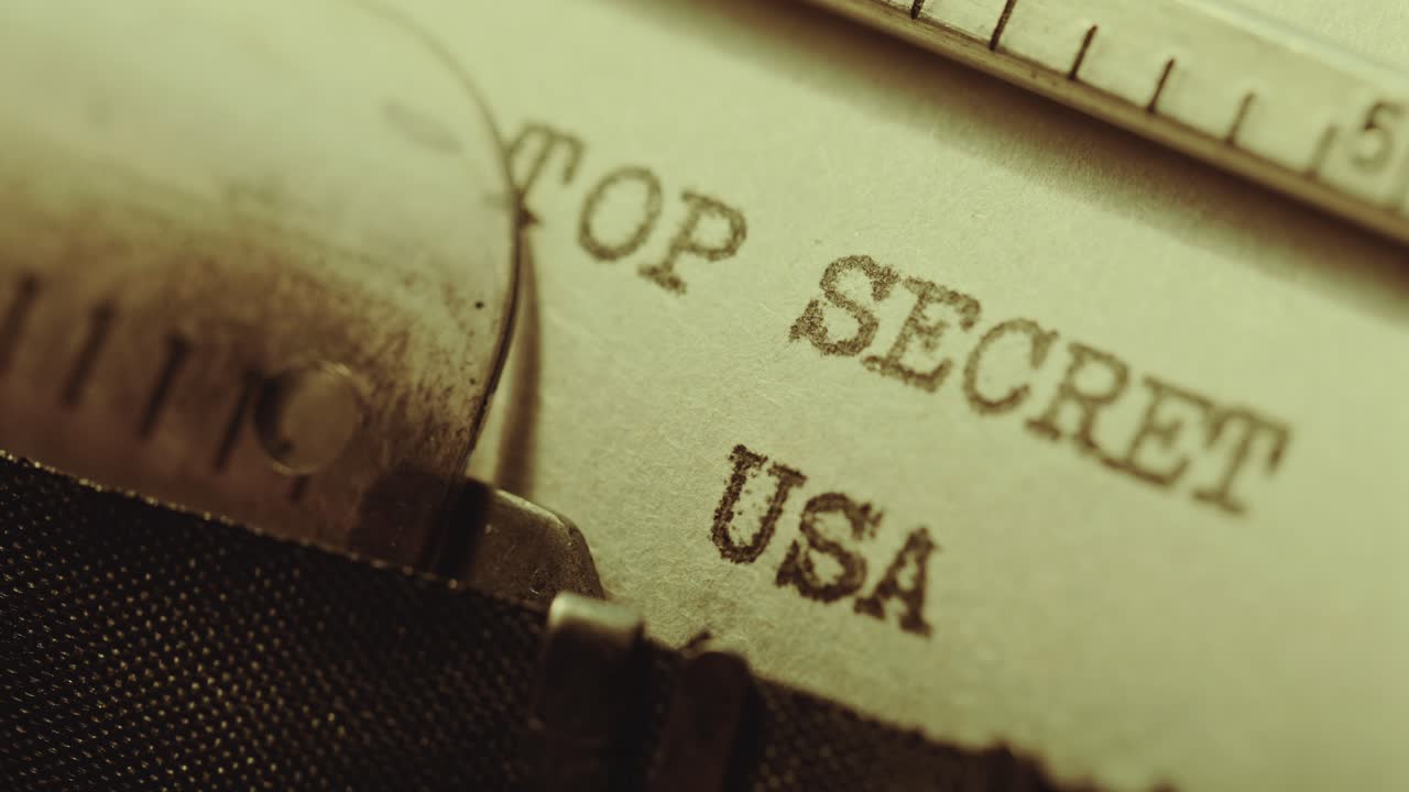 Typewriter Typing Top Secret USA Title on Paper Page