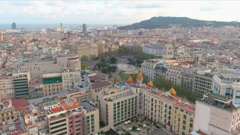 barcelona skyline with a mix of modern and historic architecture during the day, aerial view