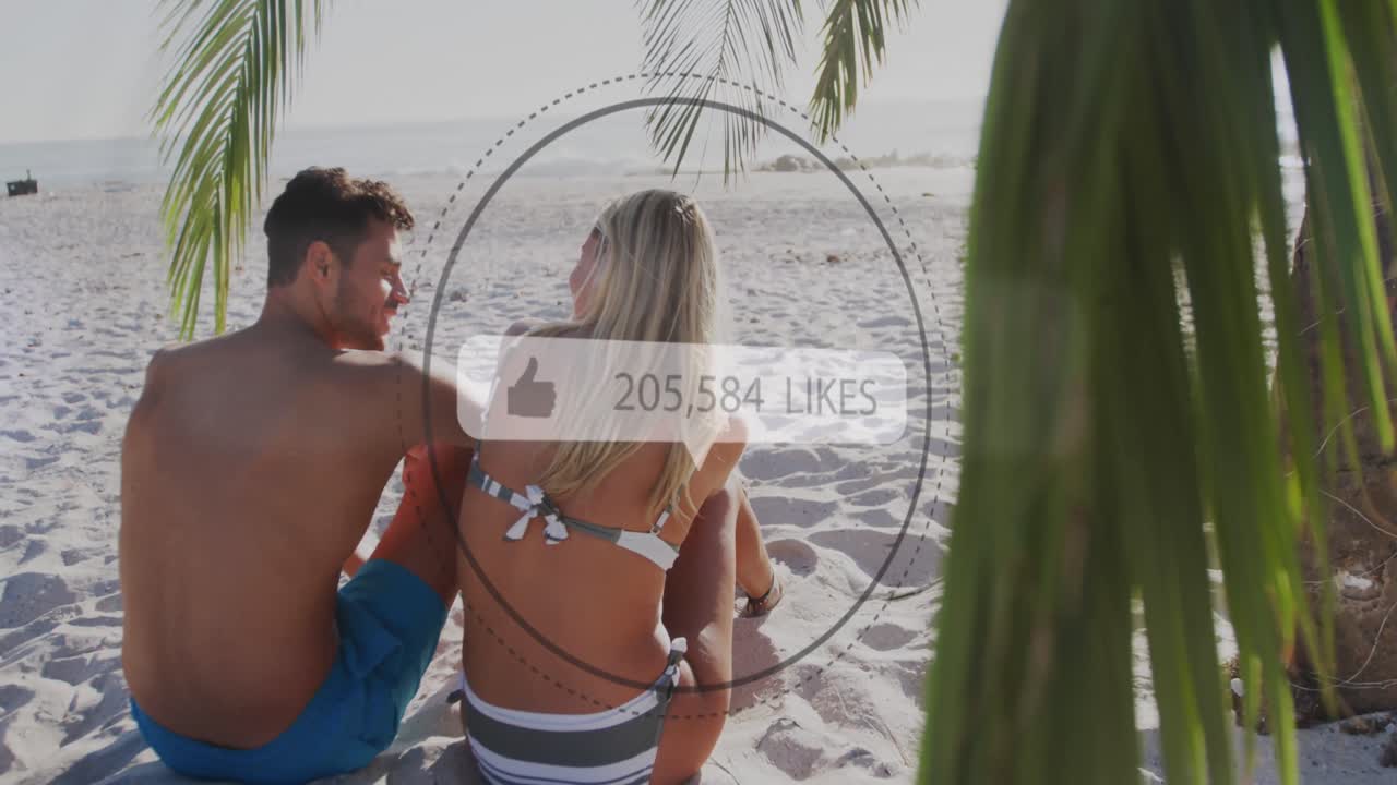 como iconos con números crecientes contra la vista trasera de una pareja caucásica sentada en la playa