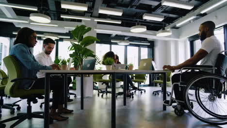 a diverse group of professionals working together in a modern open-plan office