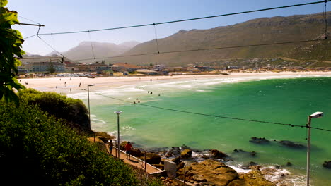 Beach-day-at-white-sand-Fish-Hoek-beach-with-people-swimming