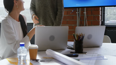 Business-executives-shaking-hand-in-conference-room-4k