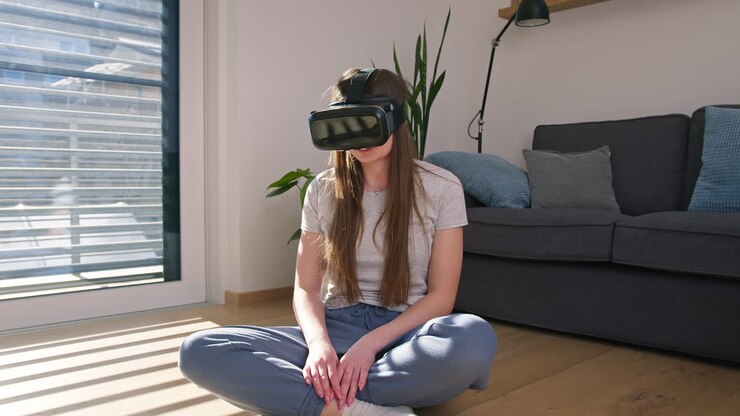 Woman immersing in a virtual world using a VR headset, front view