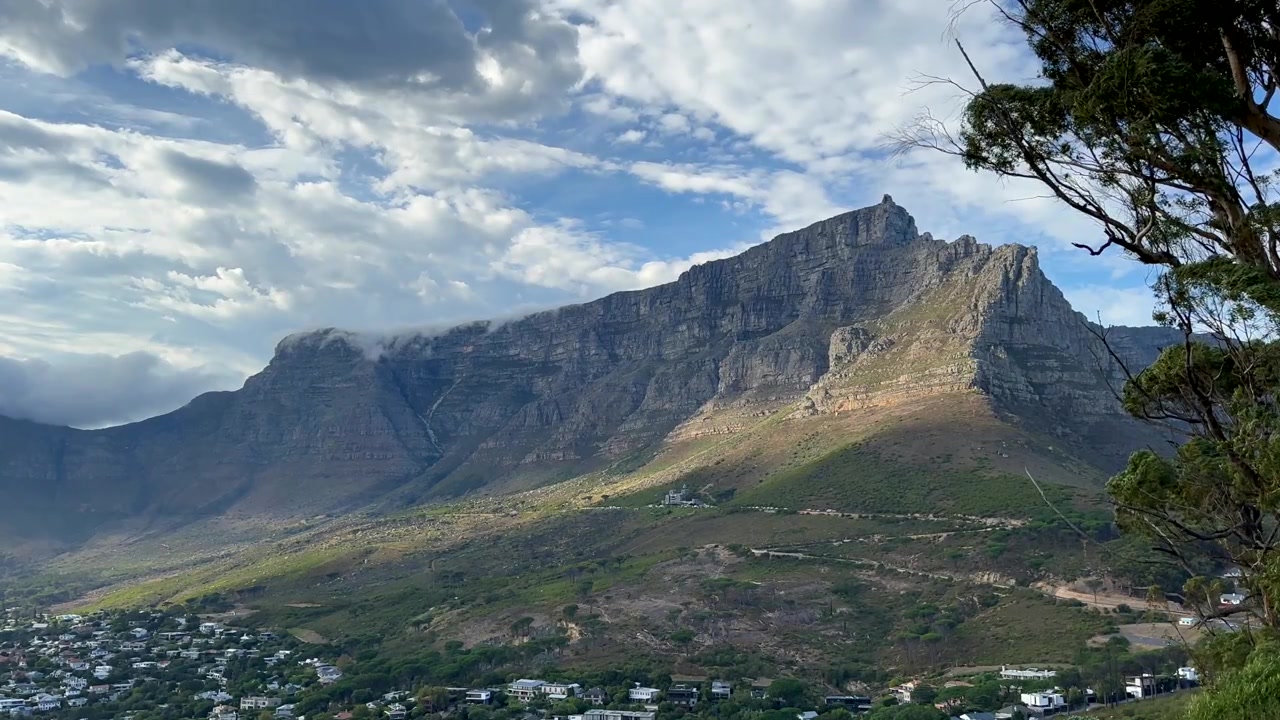Table Mountain rising prominently above the Cape Town suburbs. South Africa.