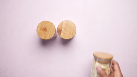 almond powder and almond in a jar on table