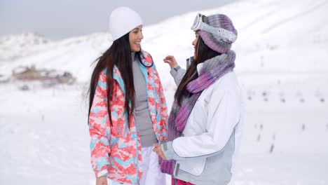 Two-pretty-young-female-friends-at-a-ski-resort