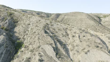 massive stone mountains with trees in georgia. aerial