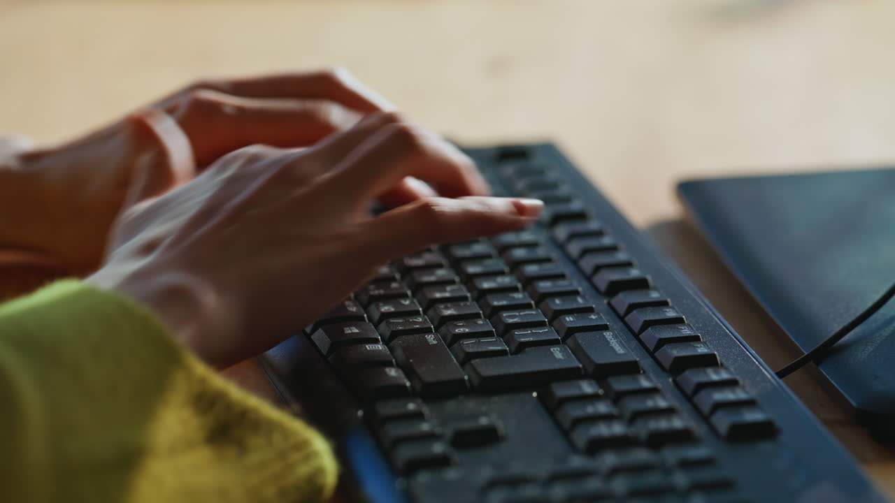 Hands inputting information keyboard finalizing message buyer indoors closeup