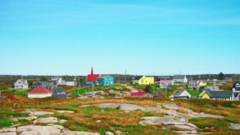 peggy’s cove in nova scotia, canada. charming fishing village with an iconic lighthouse.