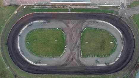 Top-down-drone-footage-of-dirt-speedring-racetrack