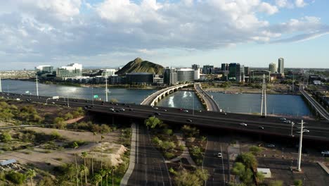 cars driving along the red mountain freeway just outside of tempe, arizona's downtown area