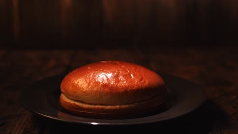 single hamburger bun on a plate