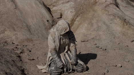 desert warrior kneeling