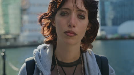 outdoor fashion portrait of young alternative style woman with tattoos and piercing at canary wharf in london docklands shot in real time 7