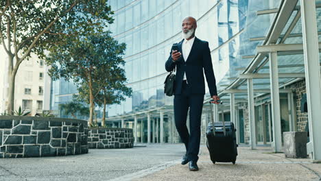 phone, suitcase and businessman walking in city