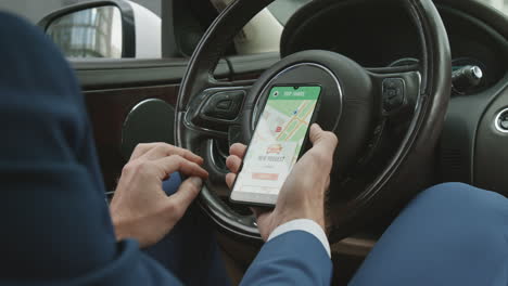 Driver Using Online Map Behind Wheel
