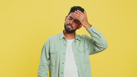 indian young man making face palm gesture, feeling bored, disappointed in result, bad news, quarrel