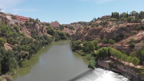 amazing lush green valley and tagus river, with white water in toledo, spain