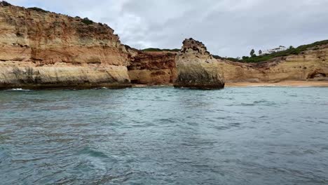 Sightseeing-unique-cliff-geological-formations-on-the-coast-of-Portugal,-view-from-boat
