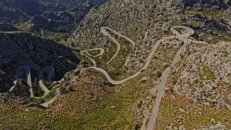 breathtaking view of dangerous curve road at coll dels reis mountain pass, serra de tramuntana, balearic islands, mallorca, spain