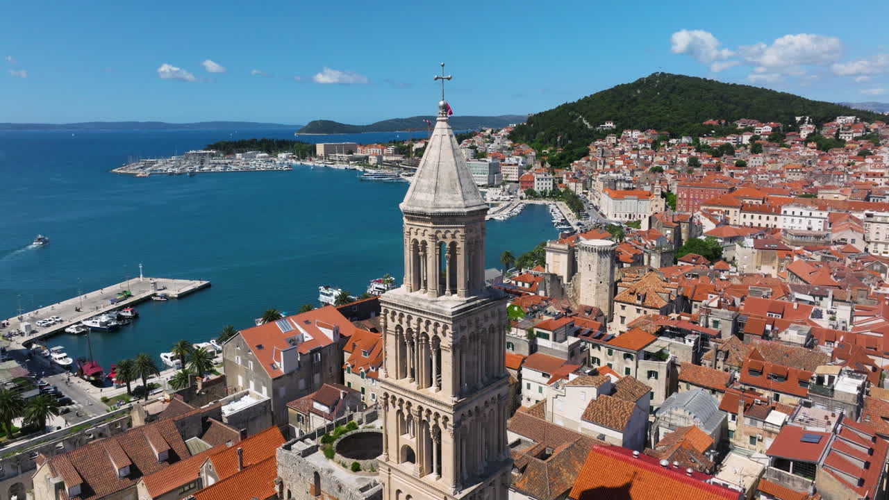 Bell Tower Of Saint Domnius Cathedral Overlooking The Calm Blue Sea In Split, Croatia. - aerial shot