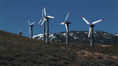 longshot of several wind turbines generating power at tehachapi california