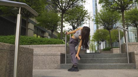 unique caucasian dancer with brown hair and flexible body moving around creating different poses and moves while staying positive and smiling all the way through spinning free spirit slow motion