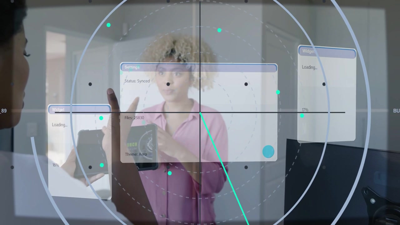 Left woman moving tablet and hand, starting tech demo, teal HUD centering, center woman reacting