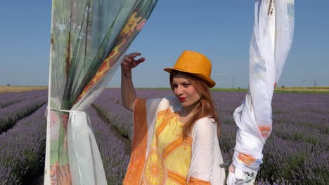 pull out from close-up of young woman to medium shot of decorative door in lavender field