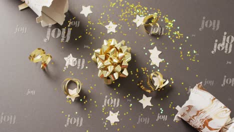 animation of christmas greetings text over christmas decorations