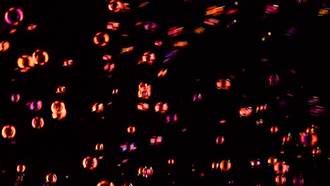 soap bubbles of red color fly black background soap bubbles of red color fly and burst in the air black background