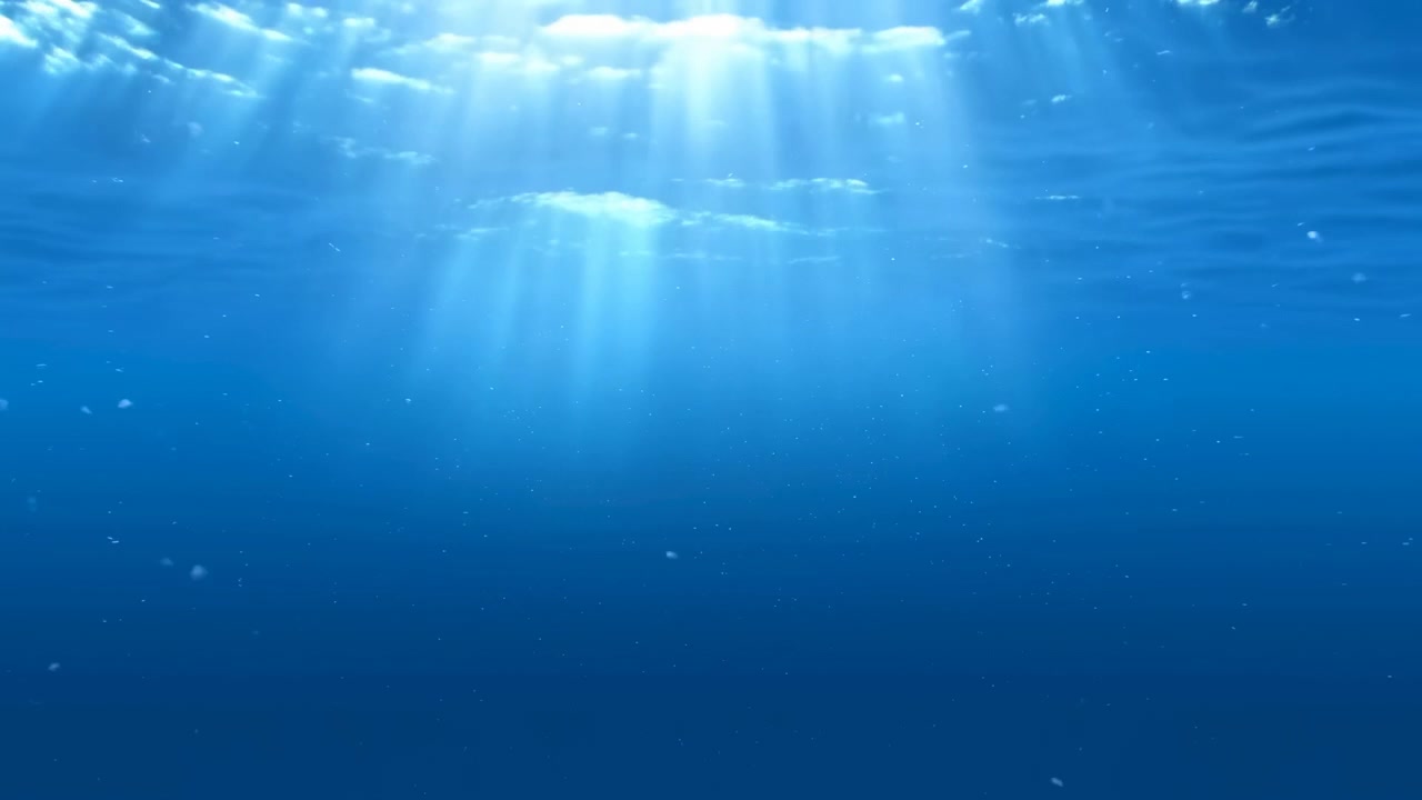 陽光が差し込む水中の青い海、水面を透過する柔らかな光線、漂う浮遊粒子