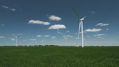 Flying-Over-The-Green-Corn-Fields-To-The-Wind-Turbines