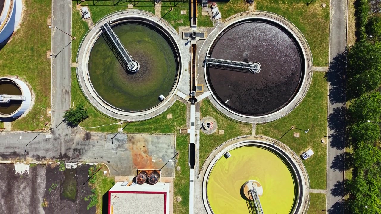 Water treatment facility processes sewage in urban area, ensuring clean water for community needs during daylight hours