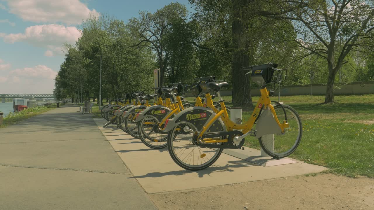 Group of Yellow City Bicycles for Rent in Green Park, Dolly Forward