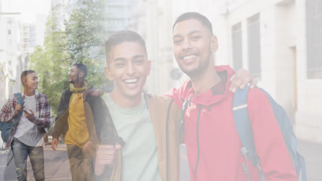 composite of happy mixed race male friends talking in street, and embracing wearing backpacks