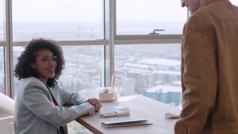 couple dining with city view