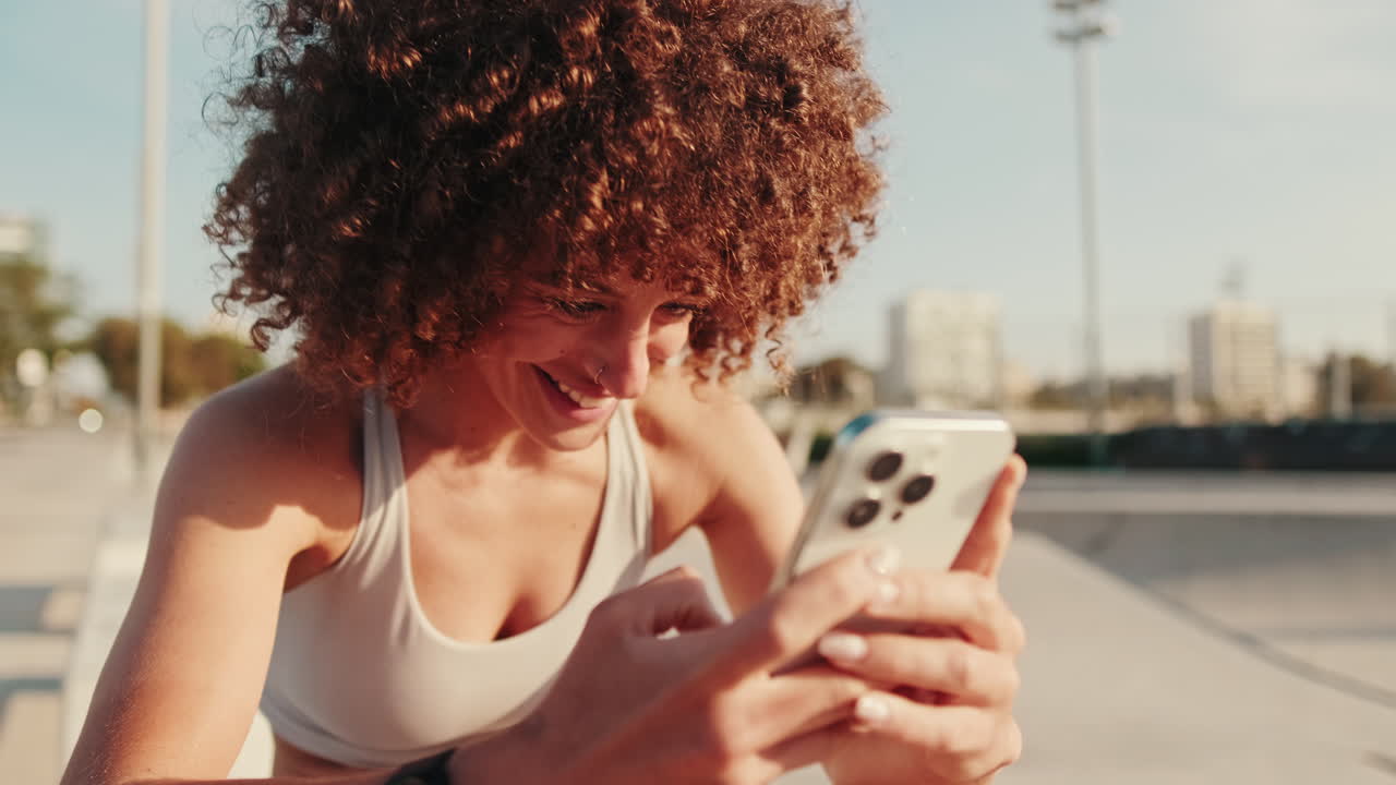 Sportswoman Using Smartphone After Workout