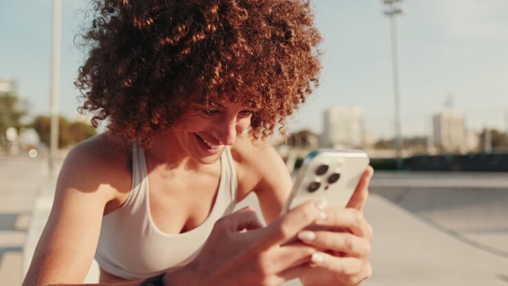 Sportswoman Using Smartphone After Workout