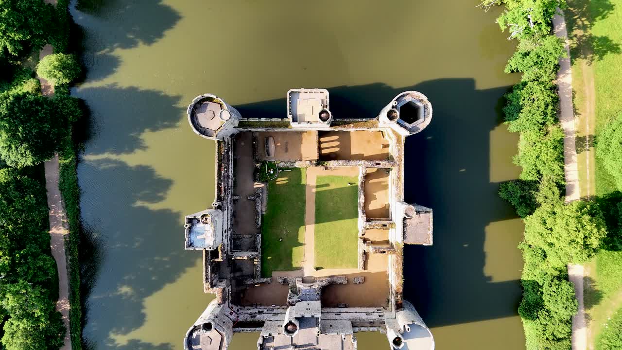 Drone-shot footage of Bodiam Castle offers timeless visuals for creators. Epic, cinematic overhead view of castle, bridge walk and moat.