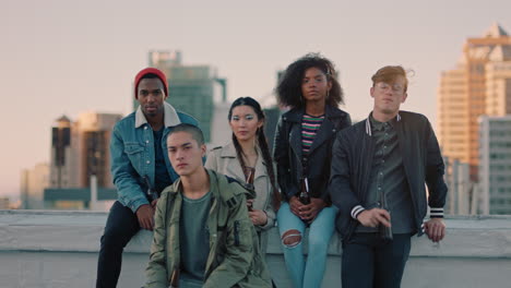 group of young diverse friends hanging out on rooftop at sunset looking confident in urban city gen z concept