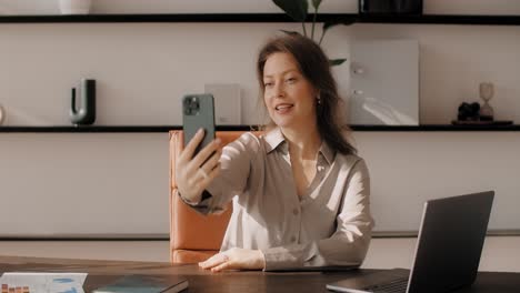 business woman having a video call in her office